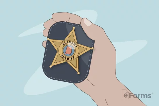 Hand holding sheriff badge.