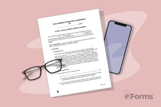 Glasses and phone next to LLC Operating Agreement.