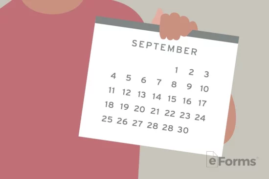Person holding up calendar displaying month of september