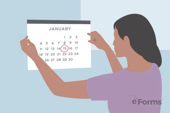 Woman placing paper calendar on wall.