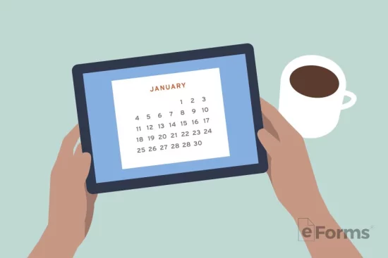 Hands holding tablet displaying calendar.