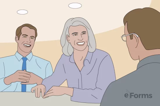 Senior at table laughing with co-workers