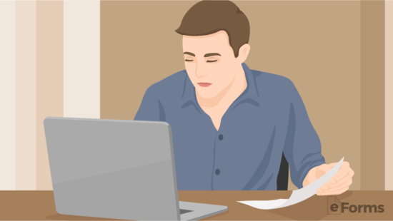 man sitting across laptop searching for templates
