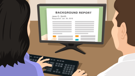 employer reviewing applicant background report on computer