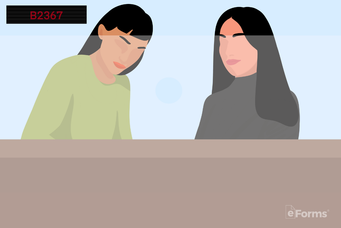Two women behind the desk working at the clerk of court office