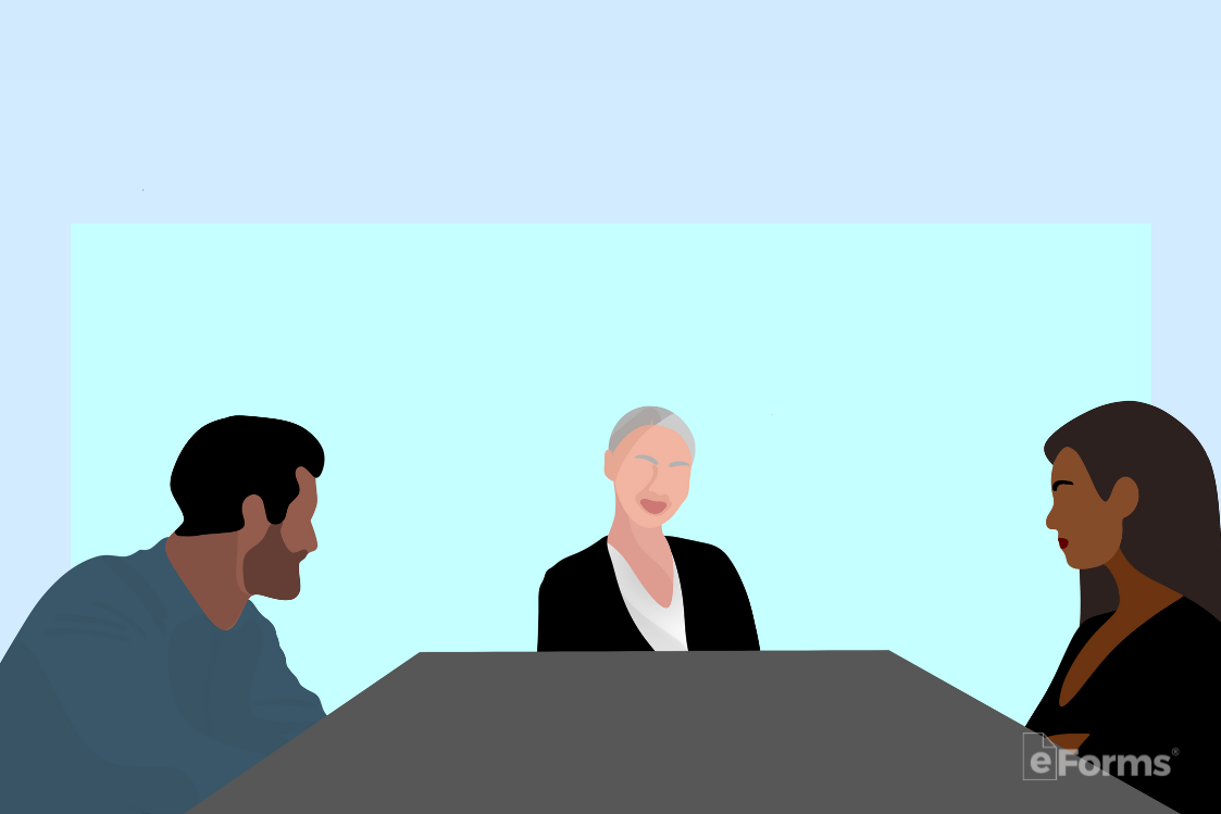 A couple going through a divorce sitting with a mediator 