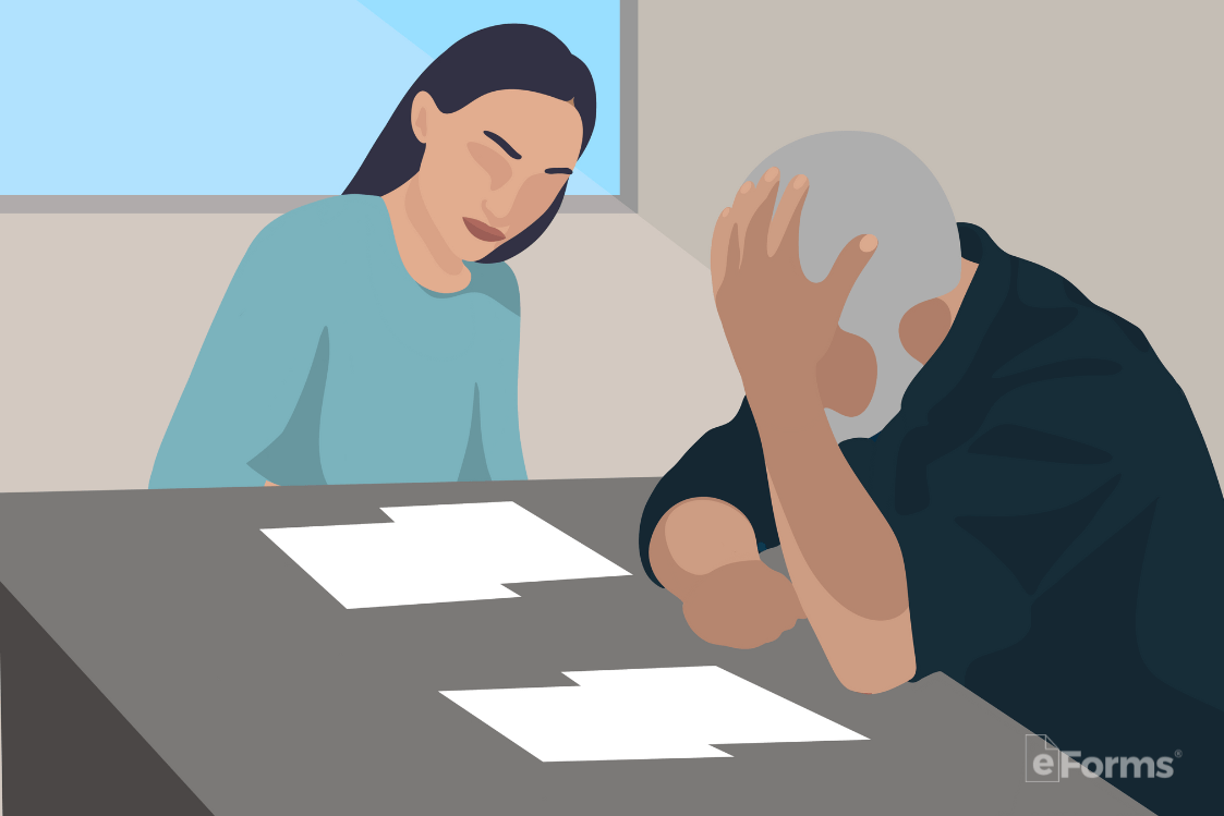 A couple in the process of divorce reviewing documents
