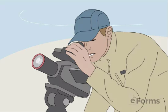 Man looking through viewfinder of video camera